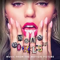 A blonde woman wears several rings that spell out "Mean Girls", with the text "Music from the Motion Picture" in white at the bottom.