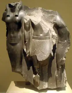 Fragmentary statue triad of Menkaure flanked by the goddess Hathor (left) and a male nome god (right), Boston Museum of Fine Arts.