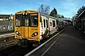 A Merseyrail Class 507 waits at the Liverpool-bound platform.