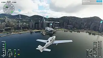 Screenshot of the game, featuring a Cirrus SR22 flying towards Hong Kong's Victoria Harbour. At the edges are the flight parameters, and the Hong Kong Convention Center is pinpointed.