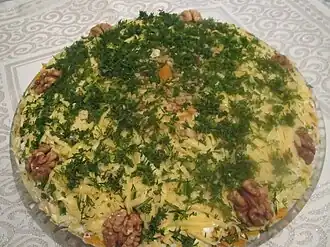 Mimosa salad, decorated with dill