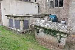 Group of 7 monuments in churchyard, adjacent to nave, Church of St Peter and St Paul