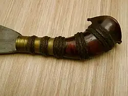 Barong hilts commonly have a metal sleeve (ferrule) and lacquered cord wound around the hilt, for a better grip