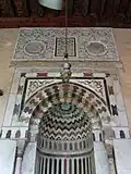 Detail of the mihrab's marble decoration and the Ottoman-era stucco decoration above