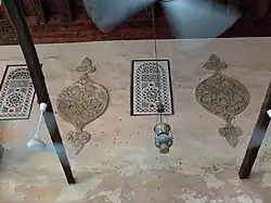 Decorative stucco medallions on the qibla wall