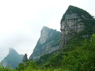 Karst landscape with mountains with cliffs and a forest