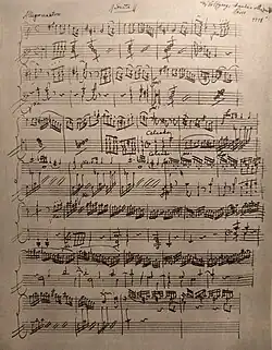 An old page of handwritten piano music
