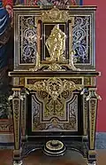 Louis XIV style cabinet on stand; by André Charles Boulle; c. 1690–1710; oak frame, resinous wood and walnut, ebony veneer, tortoiseshell, brass and pewter marquetry, and ormolu