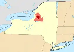 Map of New York State showing the greater Tug Hill region (light red), and its heavily forested "core" region (dark red). Core area based upon The Nature Conservancy's 150,000-acre (610&nbsp;km2) delineation.[1]