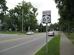 NY 65 and a shield in residential Honeoye Falls