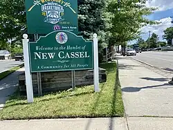 A New Cassel welcome sign at the intersection of Union and Prospect Avenues in 2021
