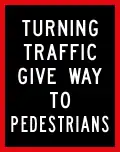 Turning traffic give way to pedestrians