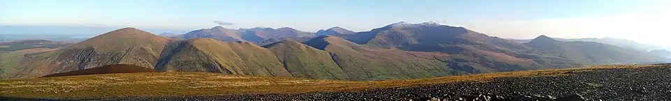Panorama of some of the Snowdon Massif including Snowdon (centre right) taken from Mynydd Mawr. The Glyderau are visible in the distance