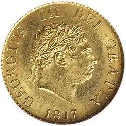 Gold coin showing a man's head facing right
