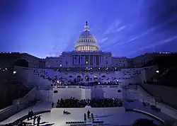 U.S. Capitol at dusk, mostly darkened but with dome floodlit from within