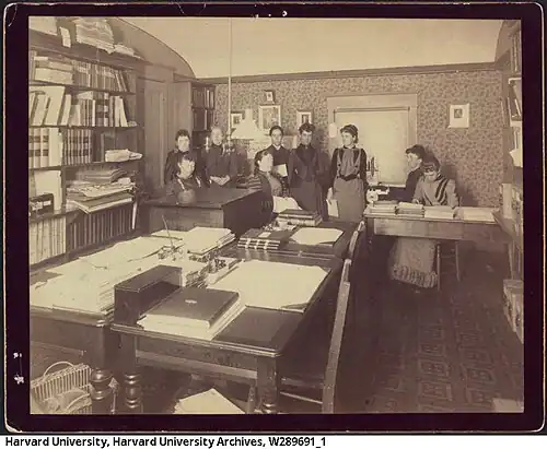 Black and white photo of the Harvard Computers and Mary Anna Palmer Draper. Left to right: unknown woman (standing), unknown woman (seated), possibly Evelyn Leland, Mrs. Draper (seated), Antonia Maury, Williamina Fleming, possibly Mabel C. Stevens (or some other Stevens), probably Florence Cushman, unknown woman.