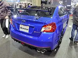 Subaru WRX STI S208, a limited-production high-performance automobile. This is a rear view of the car, showing its blue color, high trunk-mounted spoiler, and nameplate.