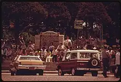 People congregate in the town square during a parade in June 1974