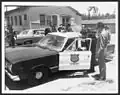Old patrol car in the 1960s, with Puerto Rico Governor Roberto Sánchez Vilella.