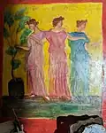 Painting of three women on a wall