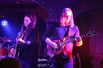 Members of Panic Room perform in July, 2017