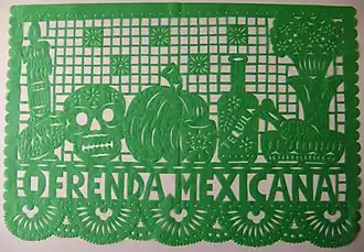A picture of a green papel picado made for an oftenda