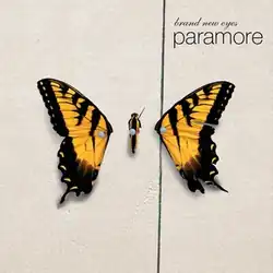 A butterfly separated from its wings pinned to a wooden fence. The band name and album title are written in lowercase in the top right corner.