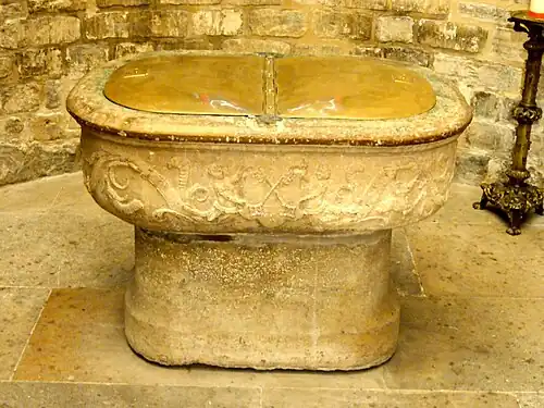 The baptismal font, in the form of the cradle of Moses, 16th century