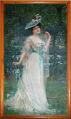 Photograph of the portrait of Phylomena Lynch shows her standing in a garden, wearing a floor length gown accompanied by a hat and a closed-umbrella.