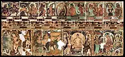 Left wall of the main cella ("2" on the plan), showing the events of the early life of the Buddha, and celestial devatas above.[85]