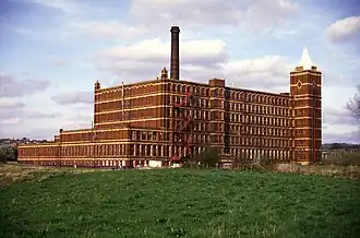 Factory chimneys, a typical feature of Northern English towns, are prominent
