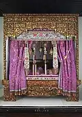 Peranakan Museum's central piece of display, the Peranakan Wedding Bed. Mrs. Quah gave birth to the first seven of her 11 children on this very bed