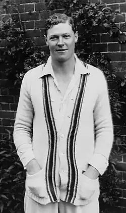 A man wearing cricket whites