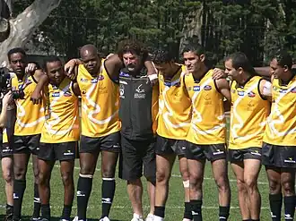 Robert Dipierdomenico coach of the Peres Peace team joining with his team to sign the joint anthem