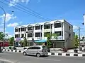A row of six reinforced concrete shophouses in Pekanbaru, Indonesia