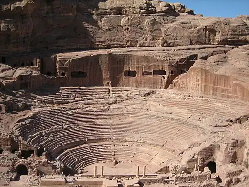 Image 2 The "Theatre" at Petra Photo: Douglas Perkins Petra is an archaeological site in Jordan, lying in a basin among the mountains which form the eastern flank of Wadi Araba, the great valley running from the Dead Sea to the Gulf of Aqaba. It is famous for having many stone structures carved into the rock. More featured pictures