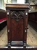 ornately carved oak pews