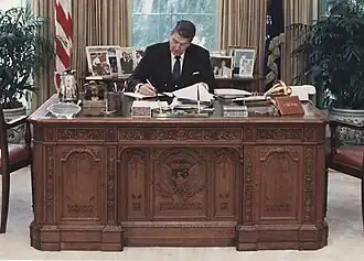 Ronald Reagan working at the Resolute desk in the Oval Office