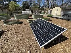 Photovoltaic solar panels provide clean electricity for this land lab.&nbsp; Using local power to operate garden tools, sensors, cameras, and water pumps provides a great example of sustainable energy for students.