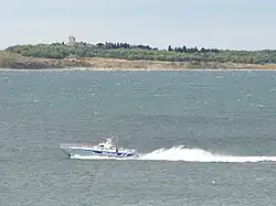 Small police boat on large body of water