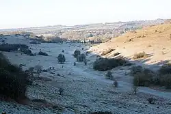 Plague Pits Valley. Burial pits were dug during the Black Death when the city's graveyards became full.[5]