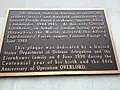 Plaque says: The United States of America recognizes the selfless service and manifold contributions of General Dwight David Eisenhower, Supreme Allied Commander, 1944–1945. At this site, General Eisenhower, on behalf of Freedom loving peoples throughout the World, directed the Allied Expeditionary Forces against Fortress Europe, 6 June 1944. This Plaque was dedicated by a United States Department of Defense delegation and the Eisenhower family on 4 June 1990 during the Centennial year of his birth and the 46th Anniversary of Operation Overlord.