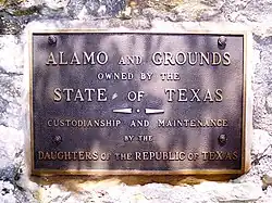 Plaque on a wall at the Alamo, recognizing ownership by the state of Texas and custodianship of the Daughters of the Republic of Texas