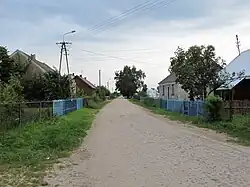 Houses by the unpaved road in Targonie-Krytuły