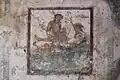 Erotic wall painting. West wall. Casa del Ristorante. Pompeii