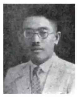 a black and white portrait of a 1920s Chinese man with a moustache