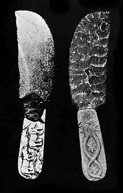 Prehistoric knife, Naqada II period, Petrie Museum UC 16294.[64] The "snake twist around rosette" is another Mesopotamian motif.[40][63]