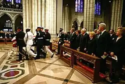 Then President George W. Bush, his wife, Laura Bush, then Vice President Dick Cheney, his wife, Lynne Cheney, former president Bill Clinton and his wife, then Senator Hillary Clinton, watch the casket of former president Ronald Reagan carried into Washington National Cathedral.