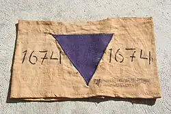 Specimen showing a purple triangle, indicating a Jehovah's Witness