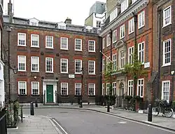 The junction of Cowley and Barton Streets, showing No.19, Cowley Street on the left, and No.8, Barton Street on the right